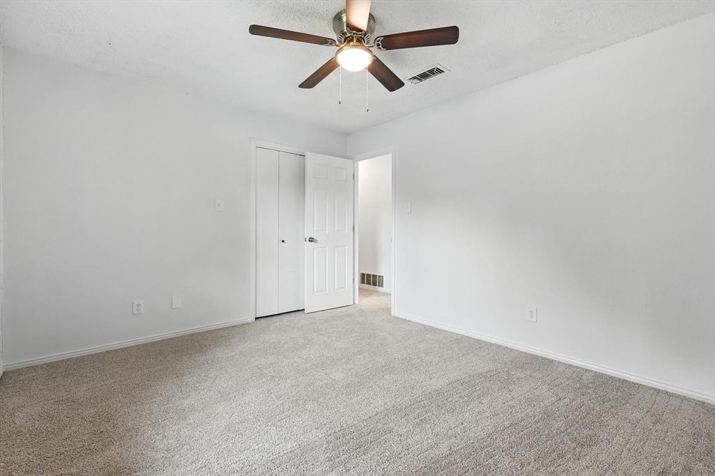 3300 Dunes Street Denton, TX 76209 - Photo 29 of 40 an empty room with chandelier fan