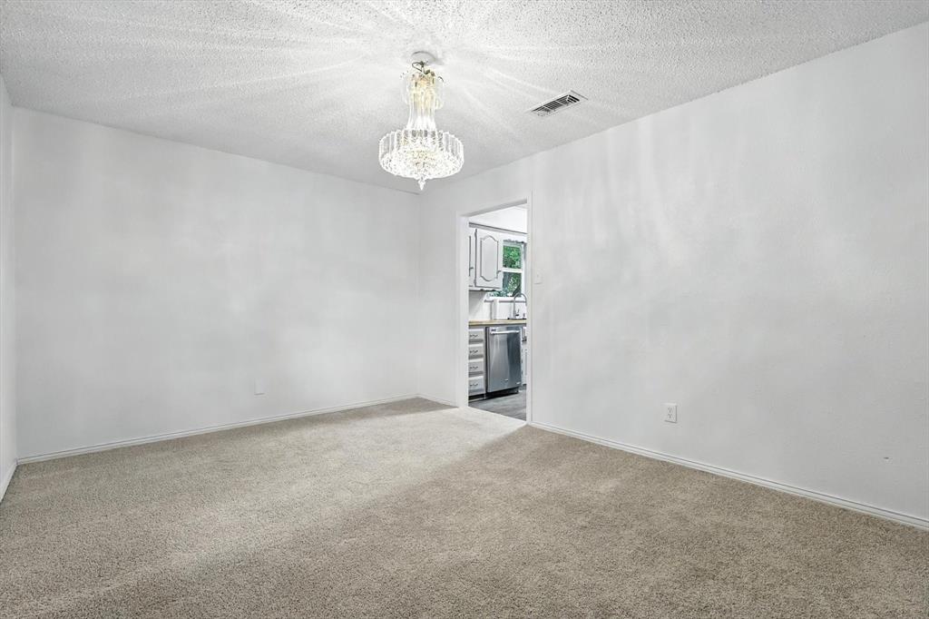 3300 Dunes Street Denton, TX 76209 - Photo 9 of 40 a view of an empty room with a window