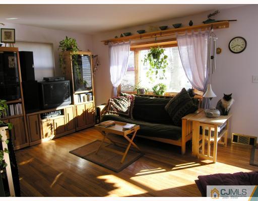 50 Wilcox Road New Brunswick, NJ 08901 - Photo 2 of 10 a living room with furniture window and wooden floor