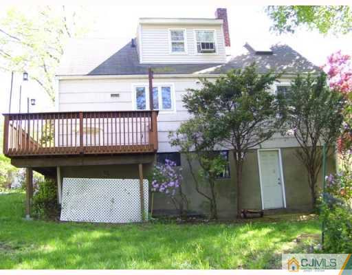 50 Wilcox Road New Brunswick, NJ 08901 - Photo 4 of 10 front view of a house with a garden