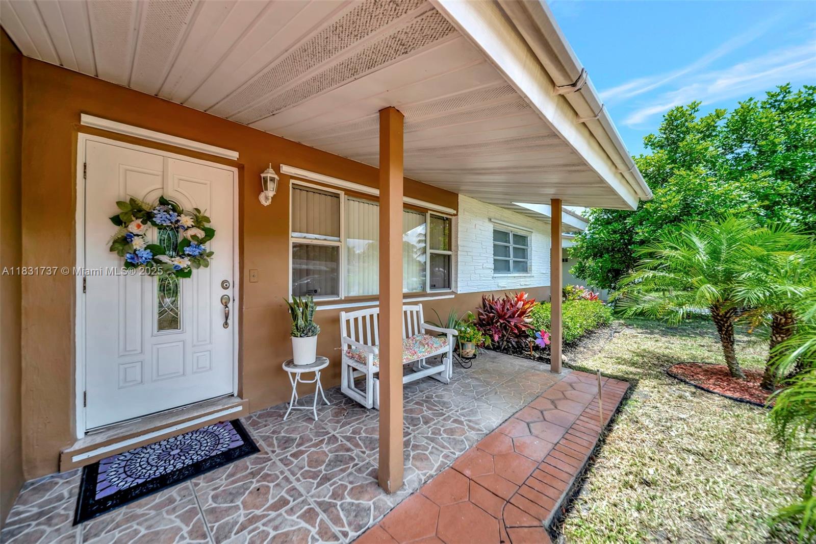 2201 North 57th Terrace Hollywood, FL 33021 - Photo 2 of 14 a front view of a house with a porch