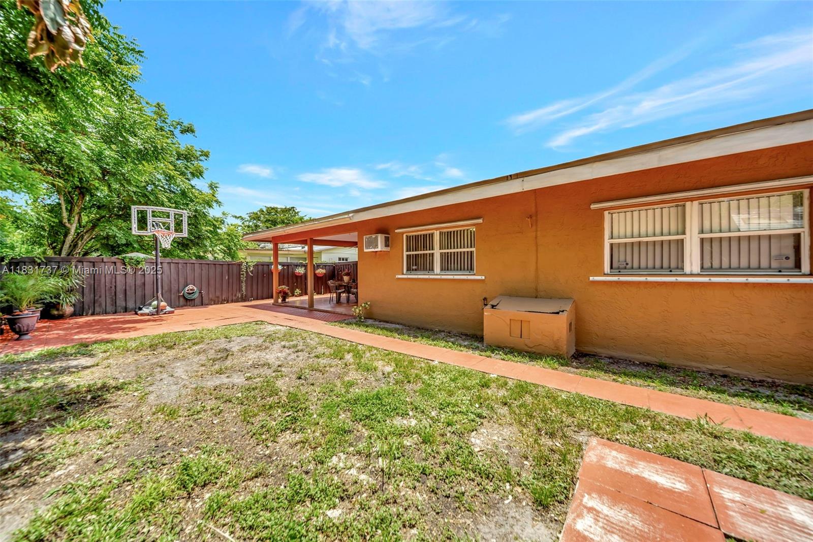 2201 North 57th Terrace Hollywood, FL 33021 - Photo 7 of 14 a backyard of a house with yard and outdoor seating