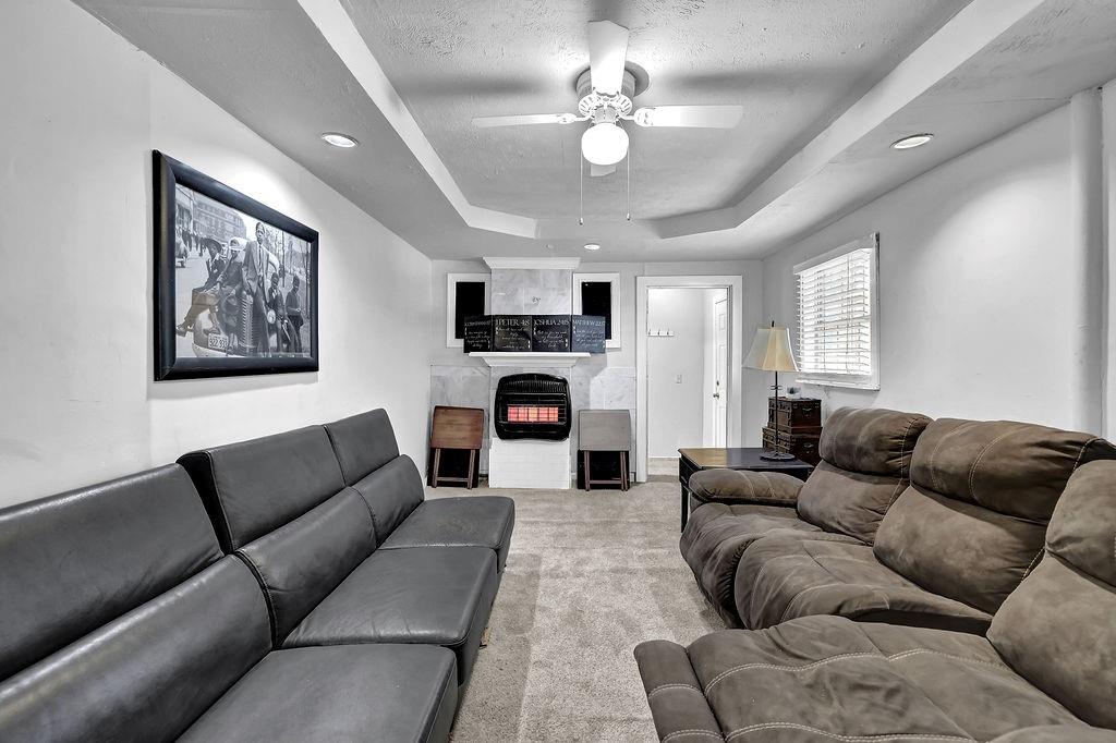 804 Rowland Road Stone Mountain, GA 30083 - Photo 11 of 23 a living room with furniture a couch and ceiling fan