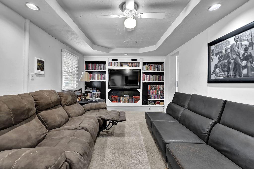 804 Rowland Road Stone Mountain, GA 30083 - Photo 12 of 23 a living room with furniture and a ceiling fan