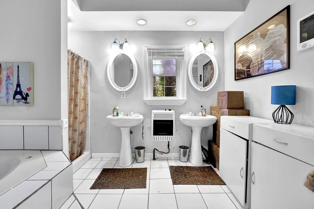 804 Rowland Road Stone Mountain, GA 30083 - Photo 19 of 23 a bathroom with a sink mirror and toilet
