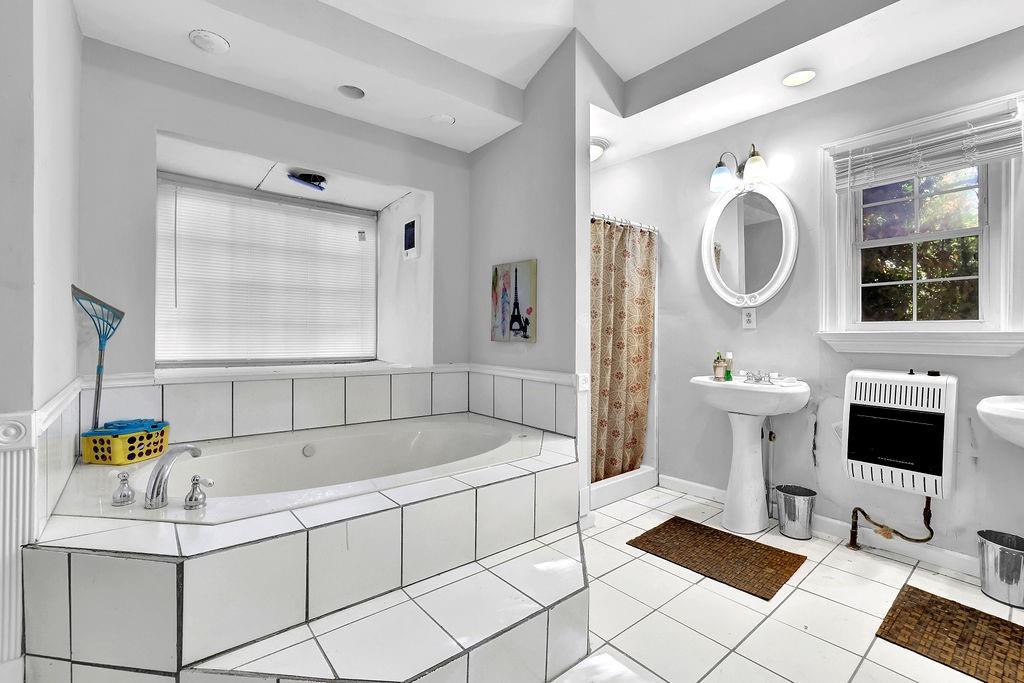 804 Rowland Road Stone Mountain, GA 30083 - Photo 20 of 23 a bathroom with a sink and a mirror