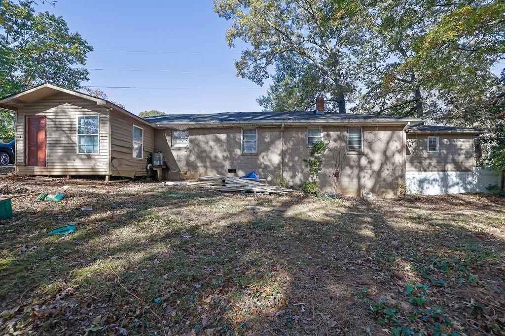 804 Rowland Road Stone Mountain, GA 30083 - Photo 22 of 23 a view of a house with a yard