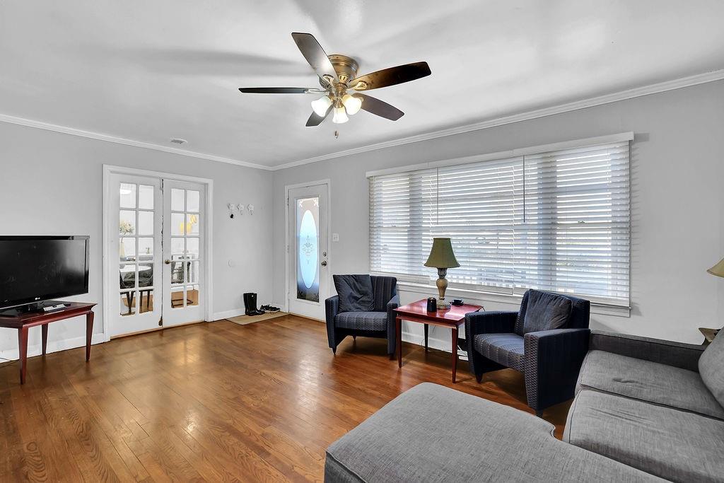 804 Rowland Road Stone Mountain, GA 30083 - Photo 7 of 23 a living room with furniture and a flat screen tv