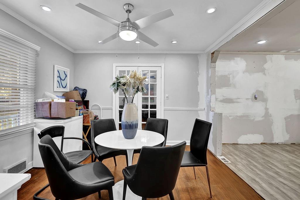 804 Rowland Road Stone Mountain, GA 30083 - Photo 9 of 23 a dining room with furniture a window and wooden floor