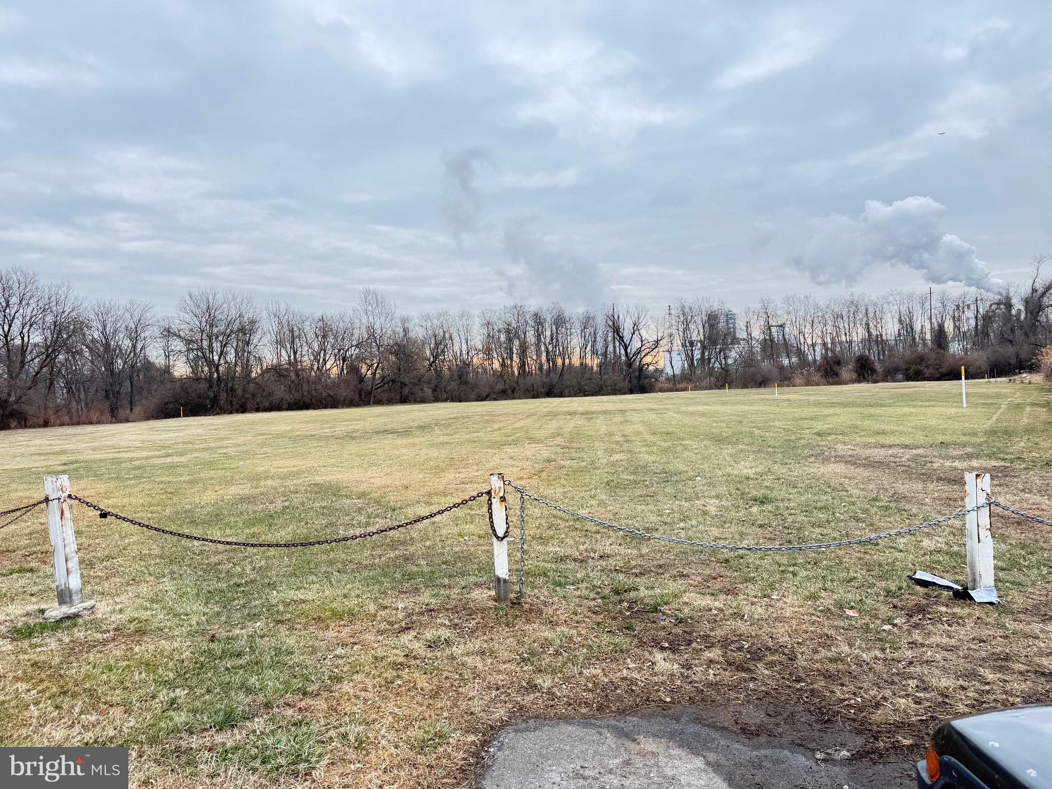 0 Price Street Marcus Hook, PA 19061 - Photo 2 of 4 a view of a field with trees in the background