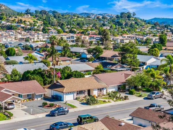 an aerial view of residential houses and street