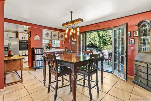 a view of a dining room with furniture window and outside view
