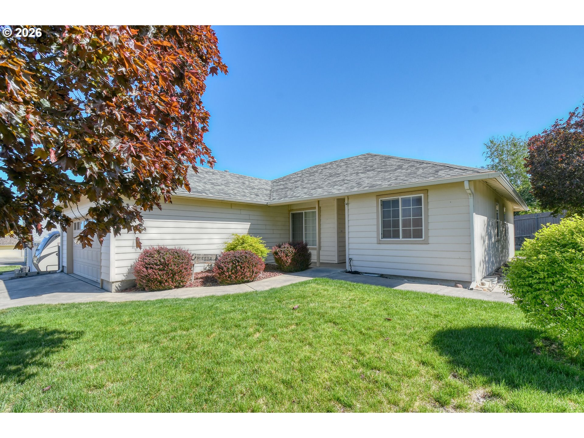 1614 Southwest 3rd Street Pendleton, OR 97801 - Photo 1 of 40 a view of a house with a yard and sitting area