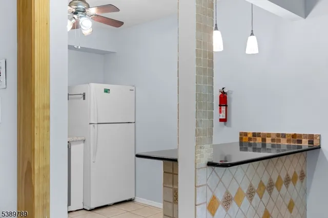 a kitchen with a stove sink and refrigerator