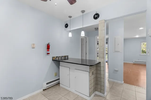 a kitchen with cabinets a stove a sink and a counter top space