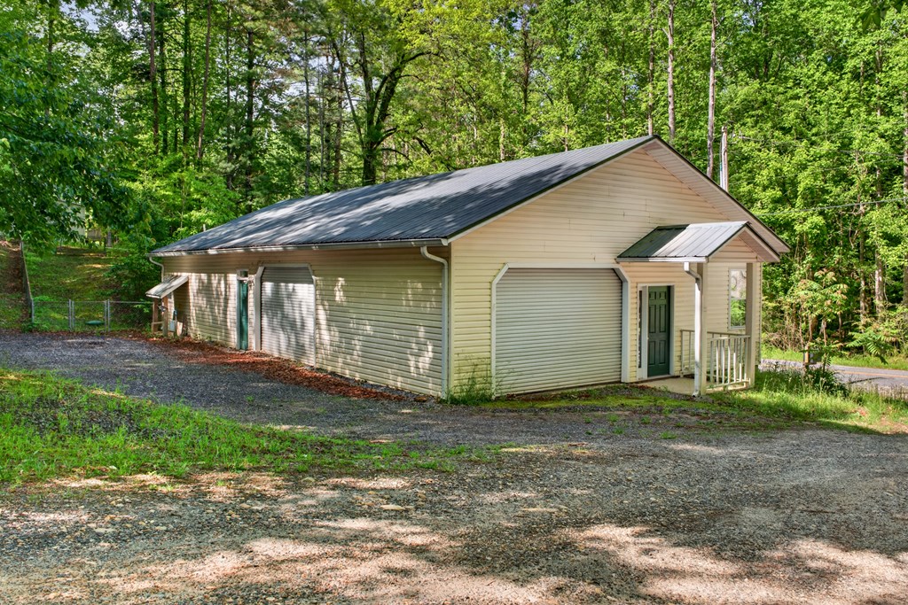 282 West Cherry Road Hayesville, NC 28904 - Photo 24 of 45 a front view of house with yard and trees all around