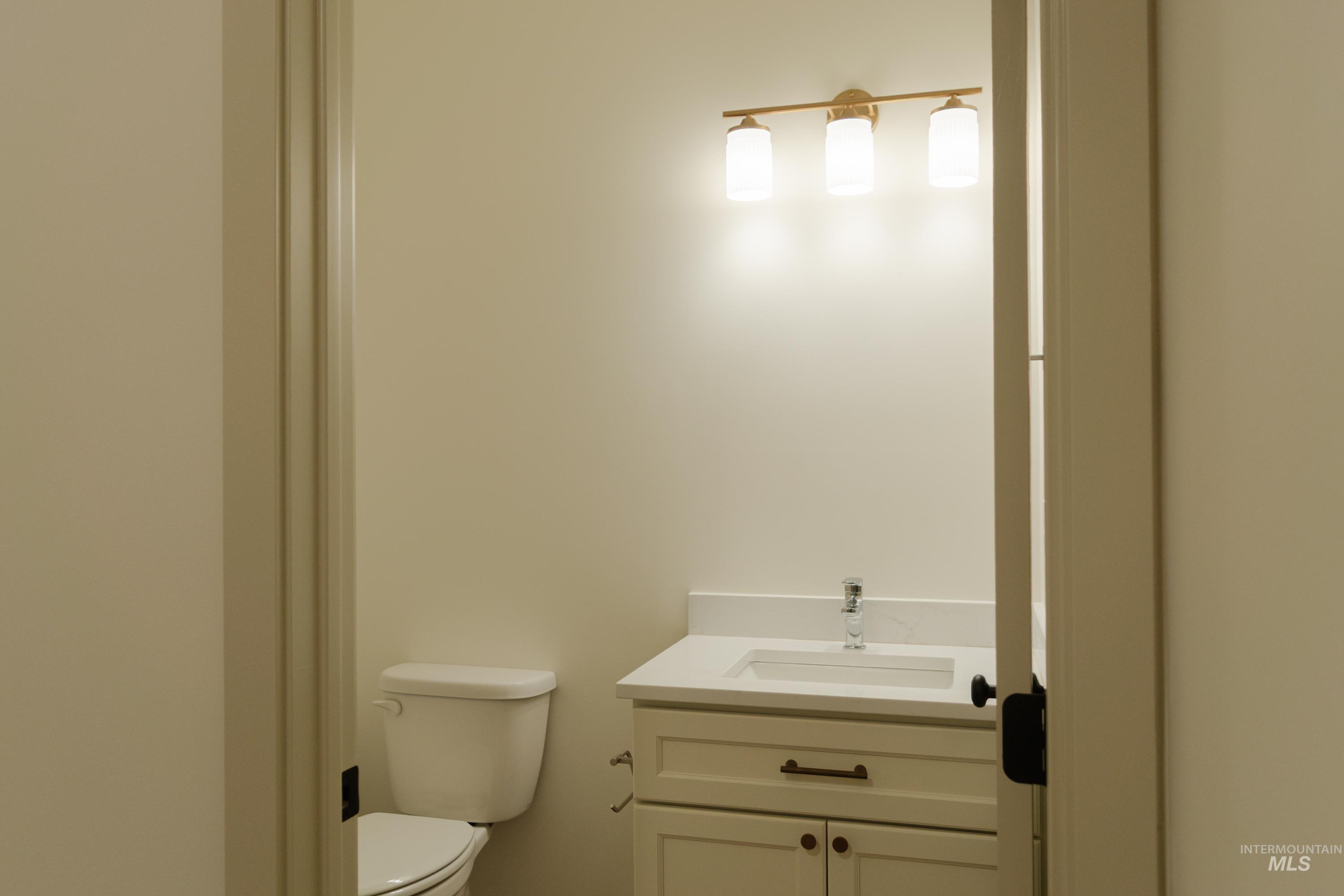 1560 Slonaker, Unit ONYX Moscow, ID 83843 - Photo 18 of 49 Half bathroom with vanity and toilet