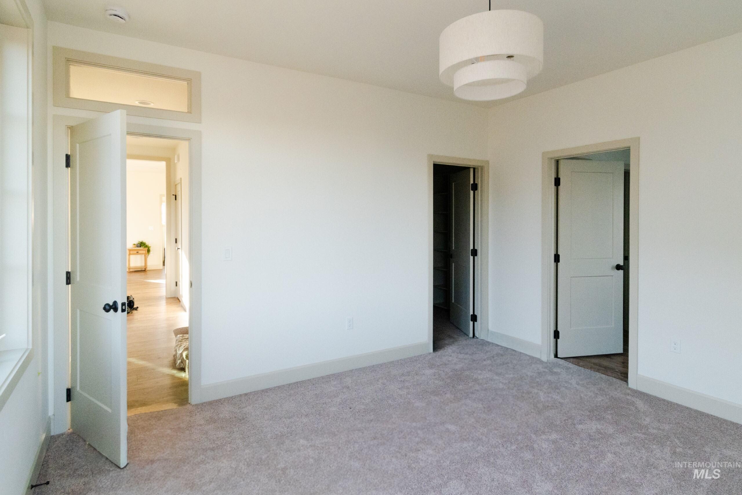 1560 Slonaker, Unit ONYX Moscow, ID 83843 - Photo 18 of 45 Unfurnished bedroom with carpet floors