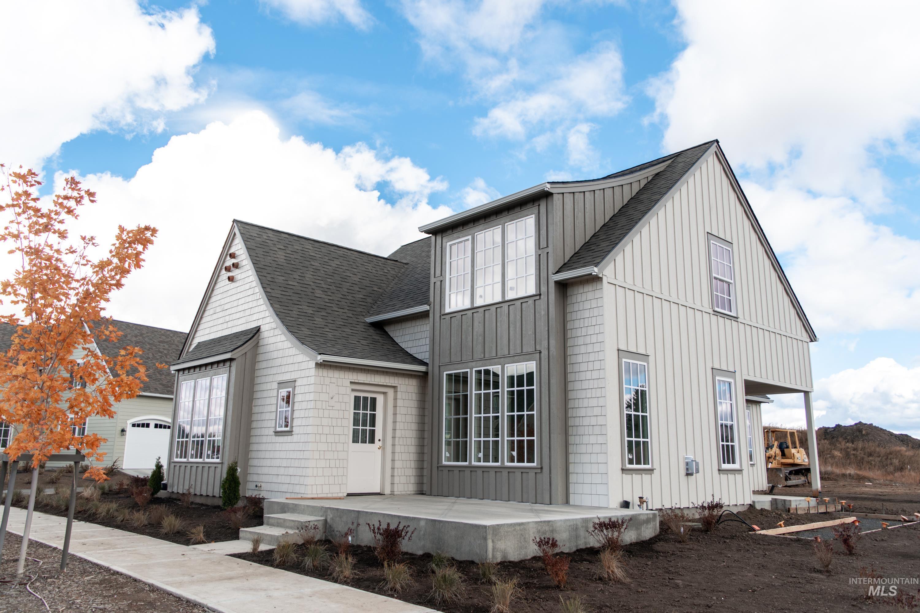 1560 Slonaker, Unit ONYX Moscow, ID 83843 - Photo 2 of 49 View of side of property with roof with shingles and board and batten siding