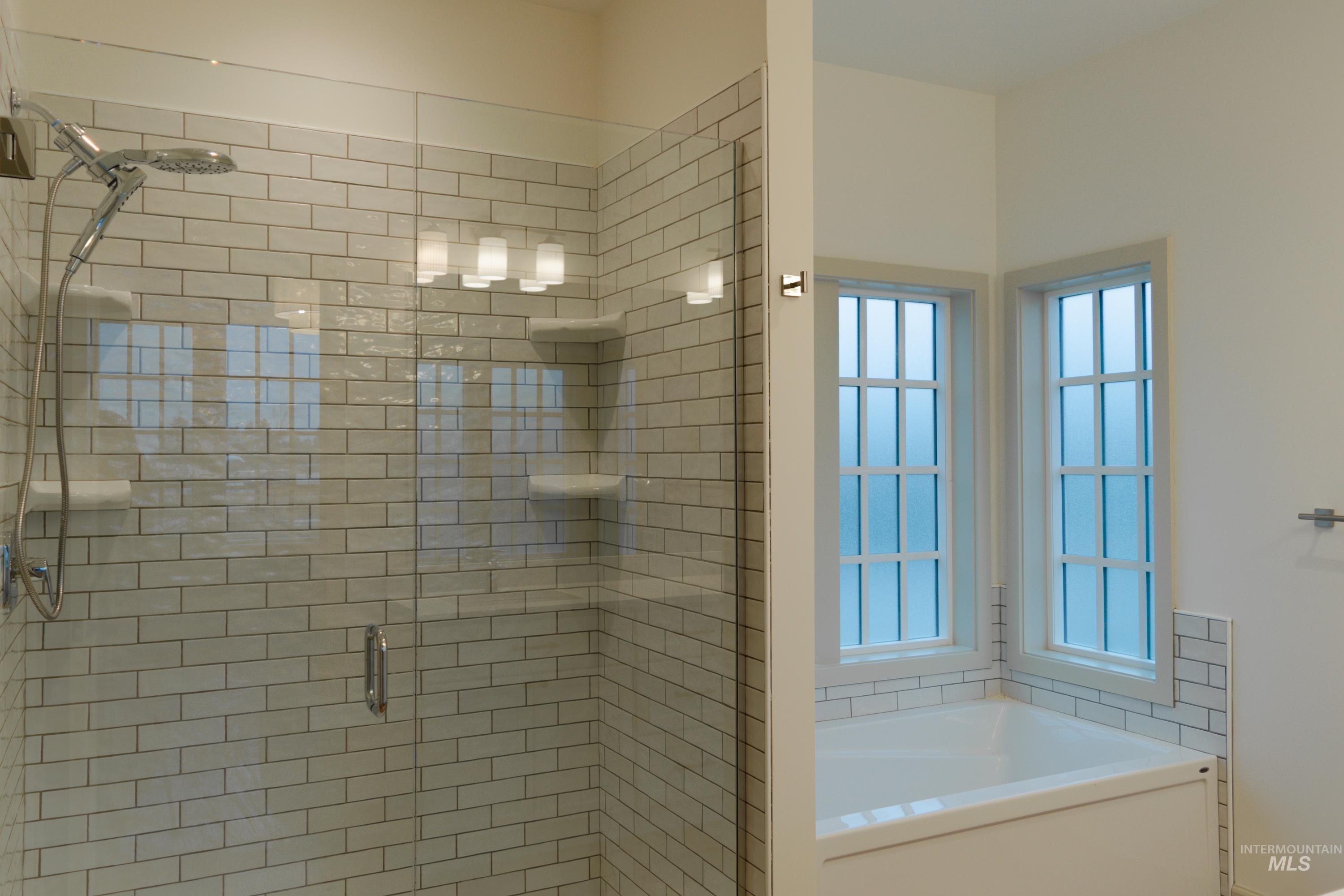 1560 Slonaker, Unit ONYX Moscow, ID 83843 - Photo 23 of 49 Bathroom with a bath and a stall shower