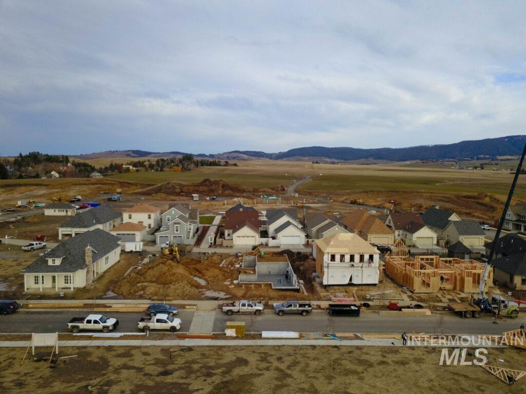 1560 Slonaker, Unit ONYX Moscow, ID 83843 - Photo 30 of 43 Aerial view of residential area with a mountainous background