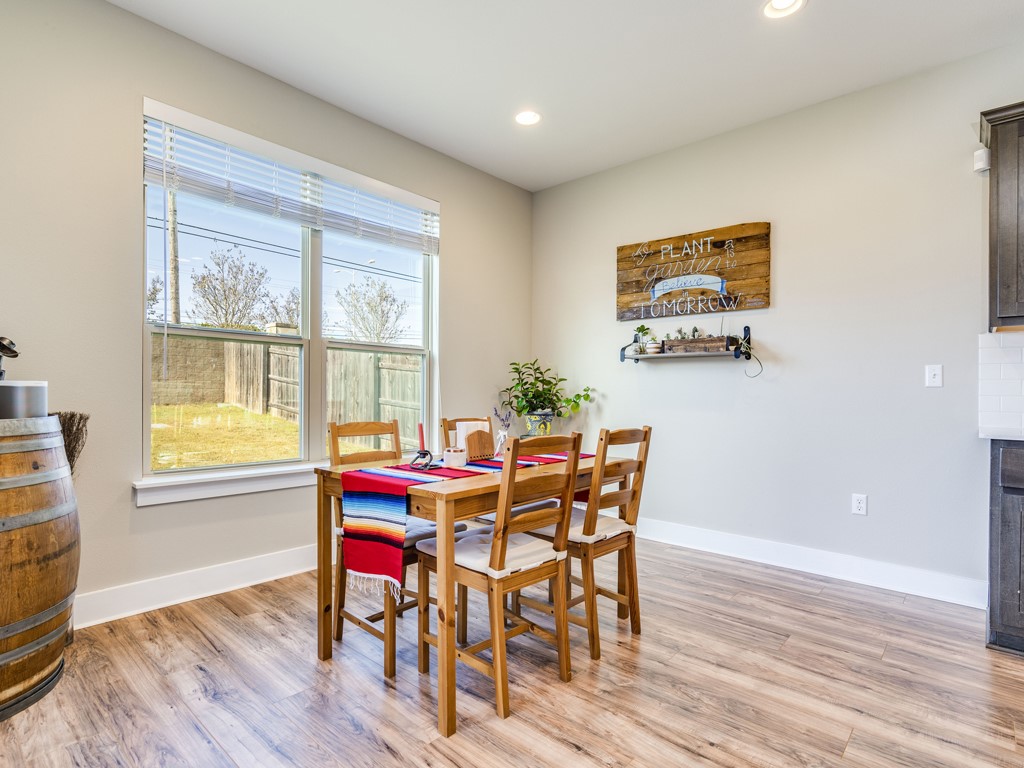 9500 Hunter Lane Austin, TX 78748 - Photo 11 of 25 a dining room with furniture and wooden floor