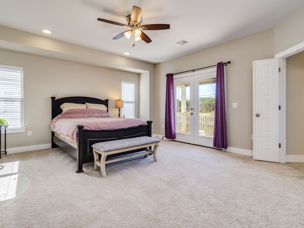 9500 Hunter Lane Austin, TX 78748 - Photo 13 of 25 a bedroom with a bed and a ceiling fan