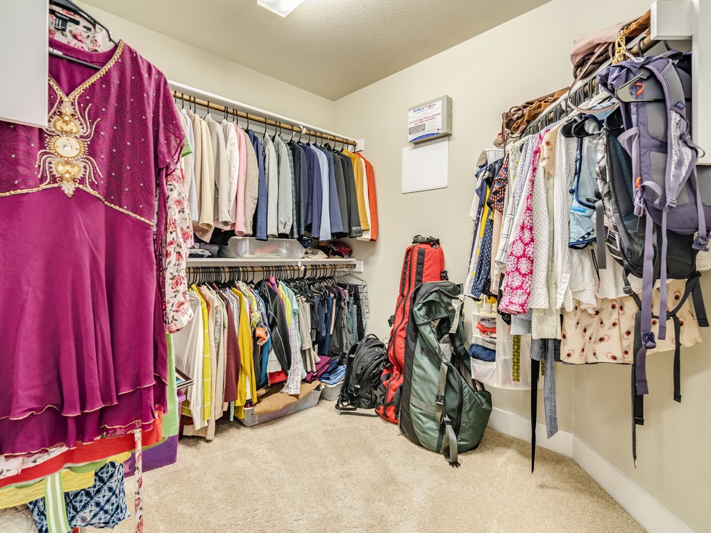 9500 Hunter Lane Austin, TX 78748 - Photo 17 of 25 a view of walk in closet with clothes