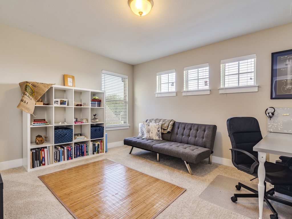 9500 Hunter Lane Austin, TX 78748 - Photo 19 of 25 a living room with furniture and a book shelf