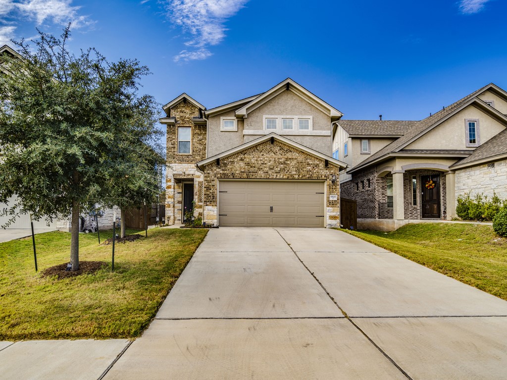 9500 Hunter Lane Austin, TX 78748 - Photo 2 of 25 a front view of a house with a yard