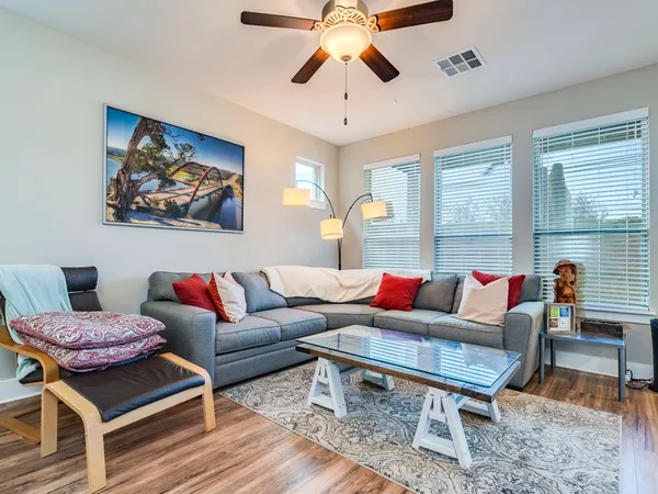 a living room with furniture and a window