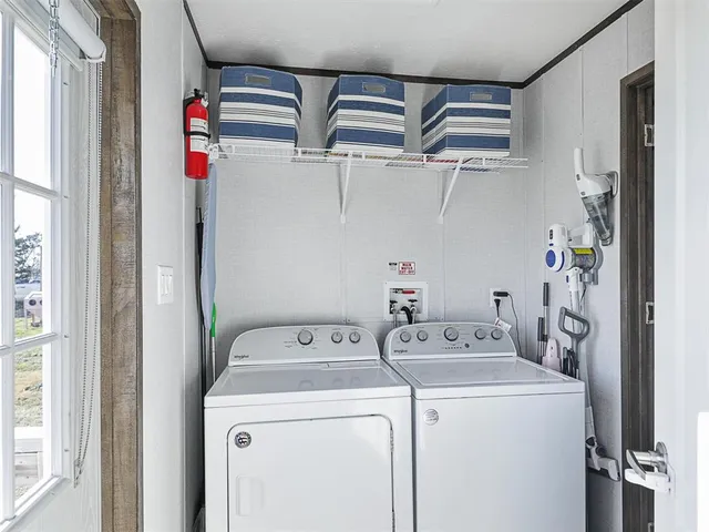 a utility room with dryer and washer