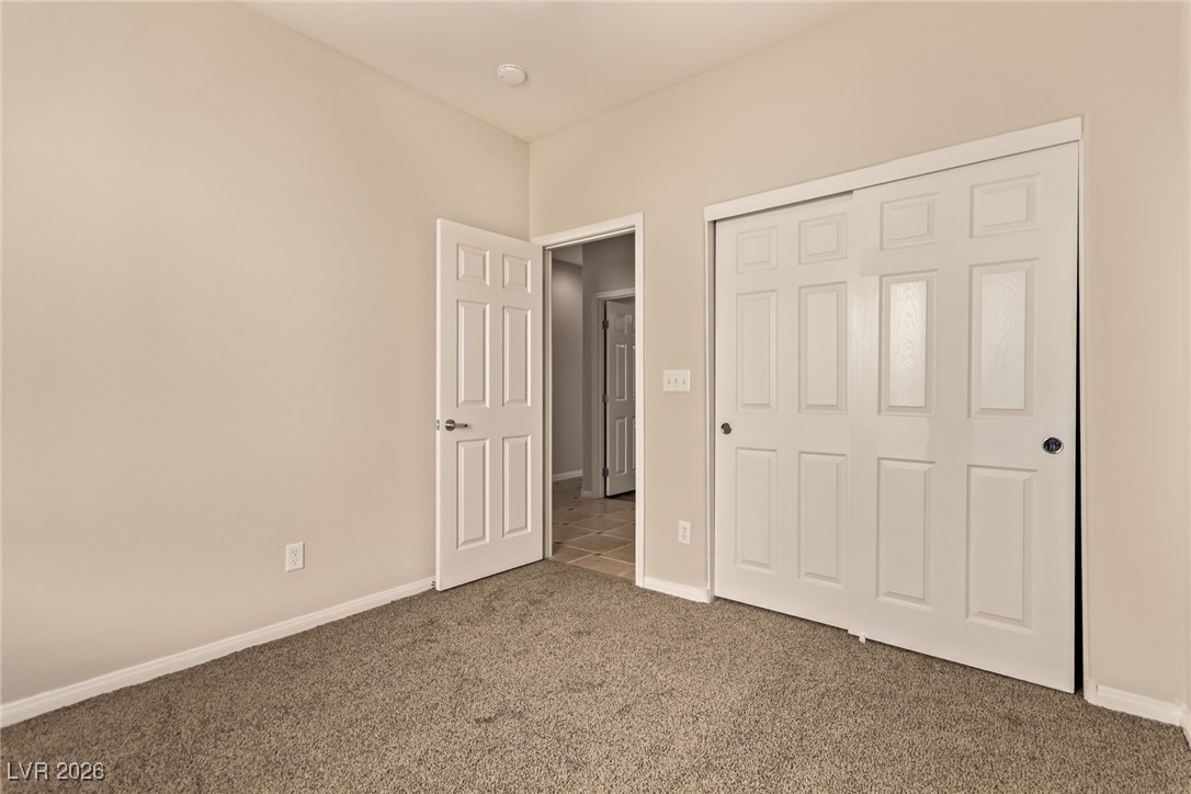 6224 Boulder Rise Street North Las Vegas, NV 89115 - Photo 21 of 27 Unfurnished bedroom with carpet and a closet