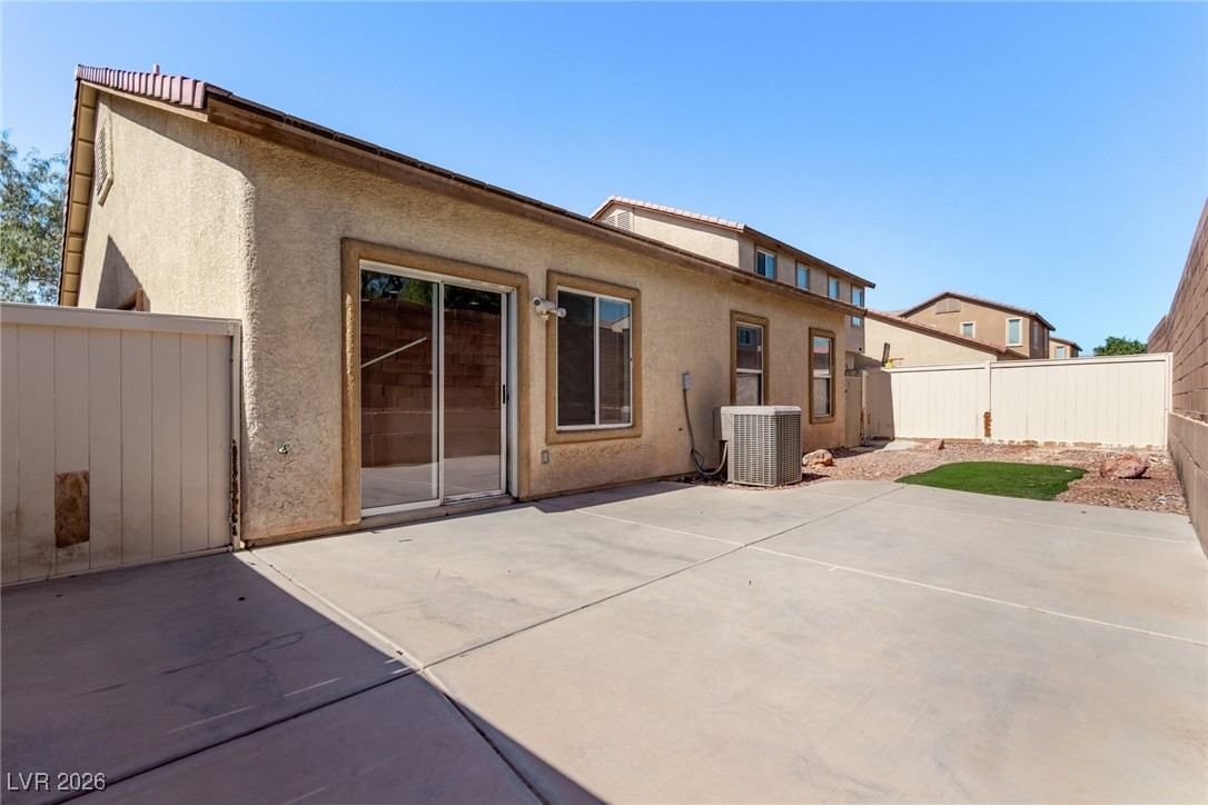 6224 Boulder Rise Street North Las Vegas, NV 89115 - Photo 27 of 27 Rear view of property featuring a fenced backyard, stucco siding, and a patio area