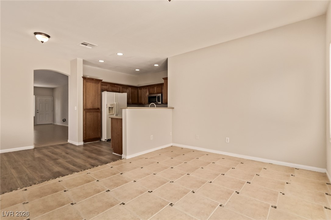 6224 Boulder Rise Street North Las Vegas, NV 89115 - Photo 8 of 27 Unfurnished living room with arched walkways and recessed lighting