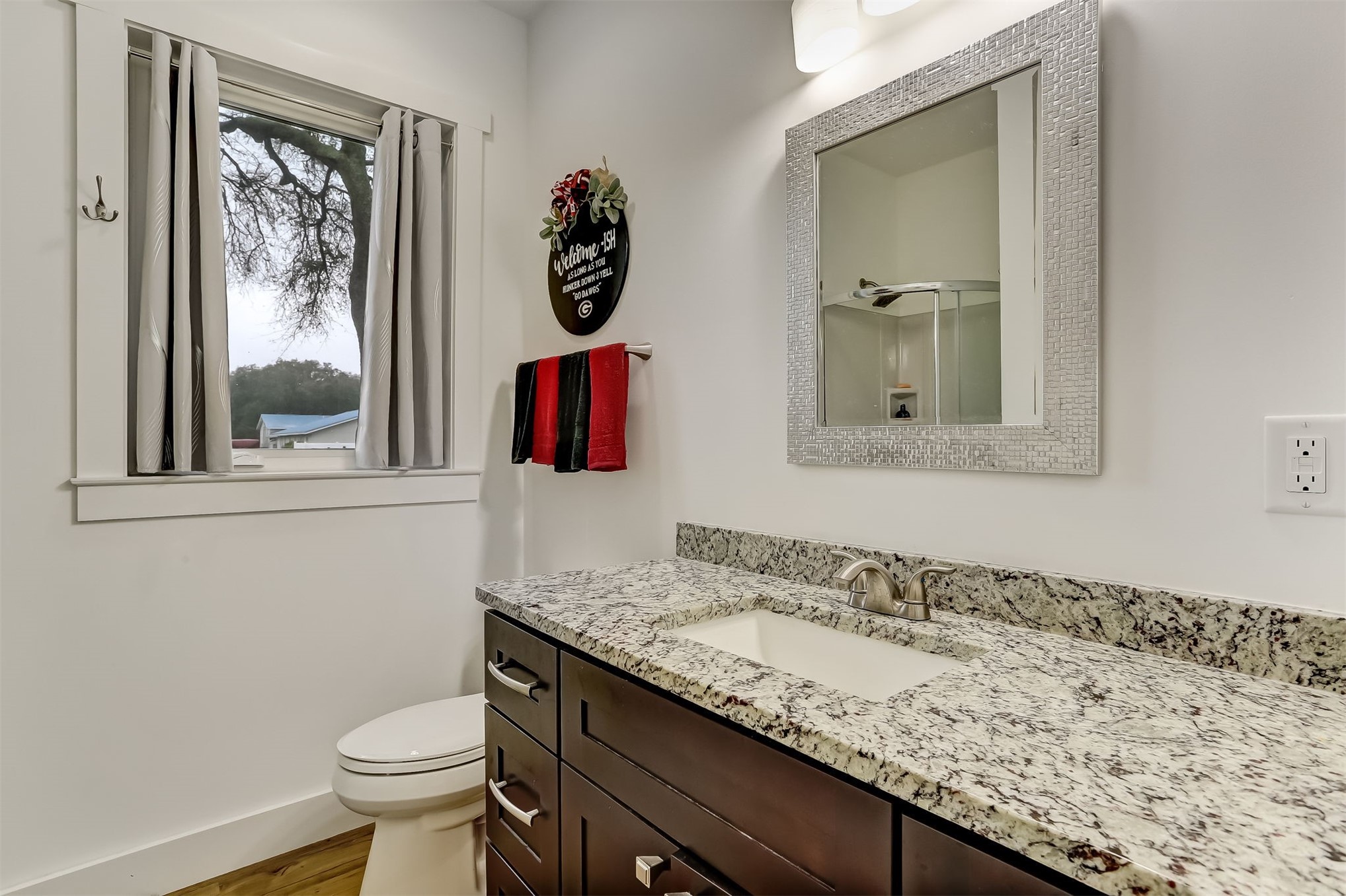 1421 Hickory Street Fernandina Beach, FL 32034 - Photo 14 of 22 a bathroom with a granite countertop sink and a mirror