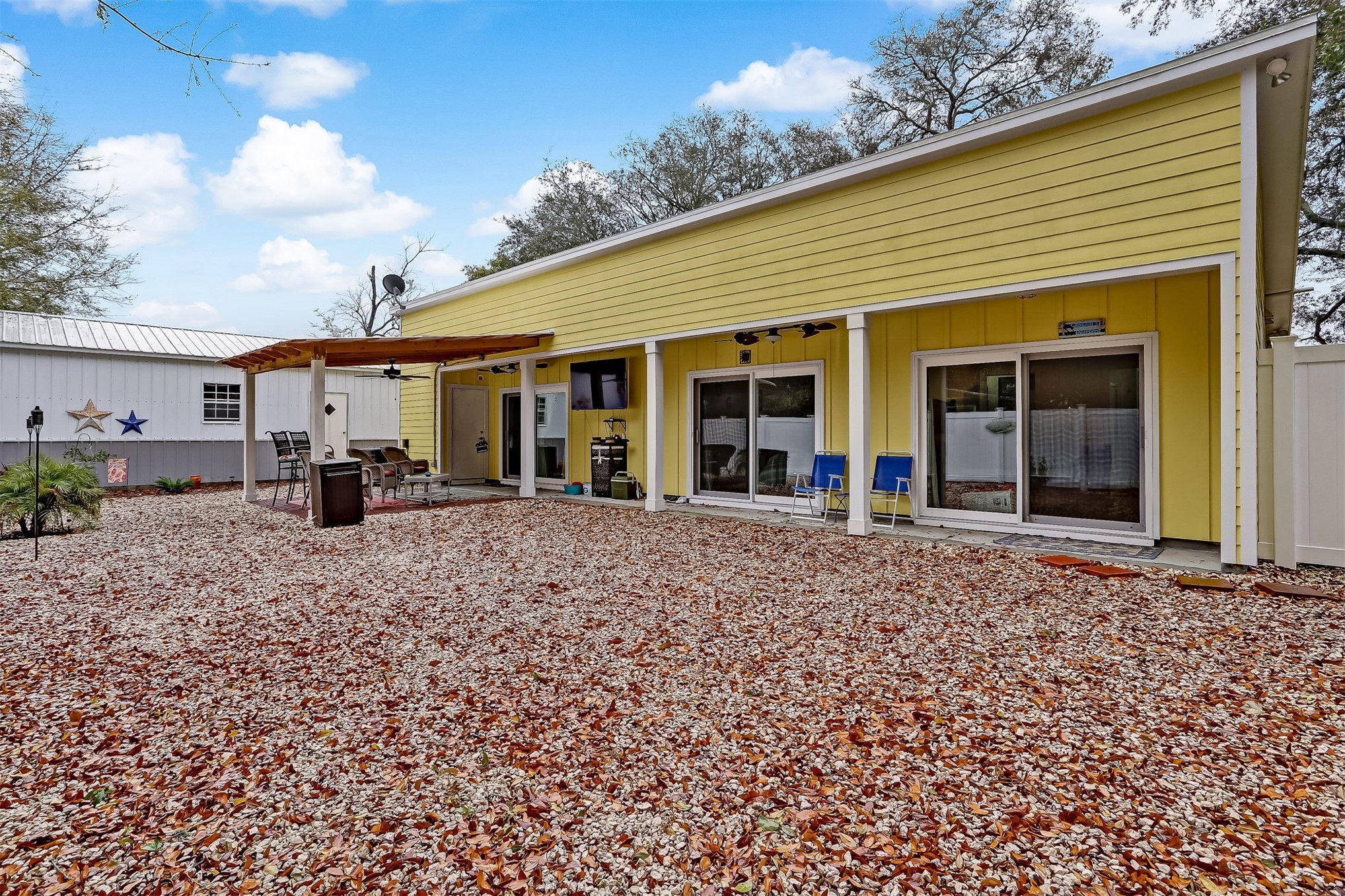 1421 Hickory Street Fernandina Beach, FL 32034 - Photo 17 of 22 a front view of a house with a garden