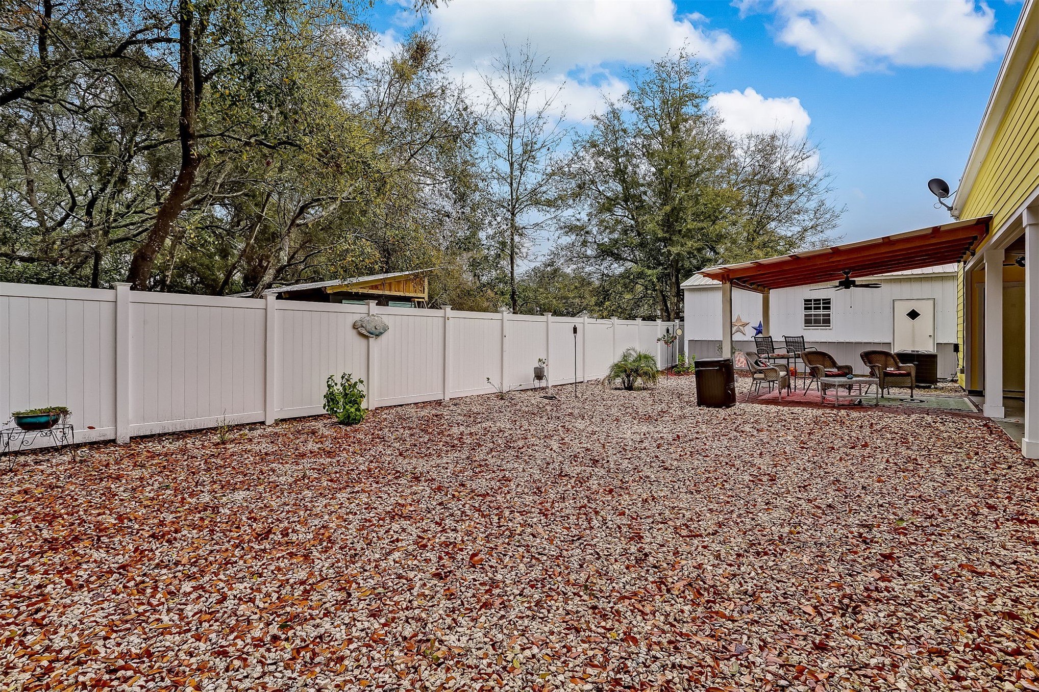 1421 Hickory Street Fernandina Beach, FL 32034 - Photo 18 of 22 a white house that has a tree in front of it
