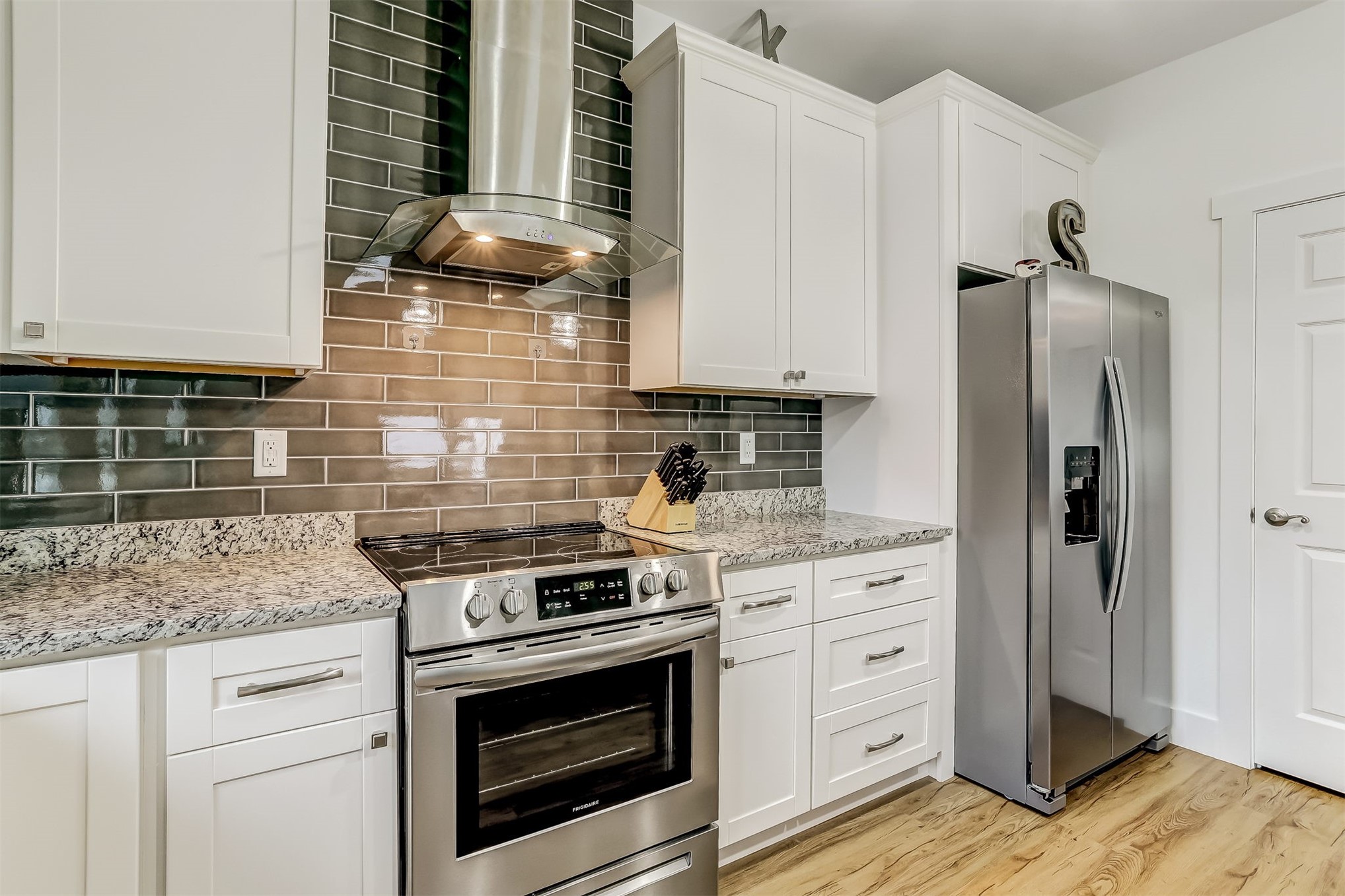 1421 Hickory Street Fernandina Beach, FL 32034 - Photo 7 of 22 a kitchen with granite countertop cabinets stainless steel appliances and a counter space