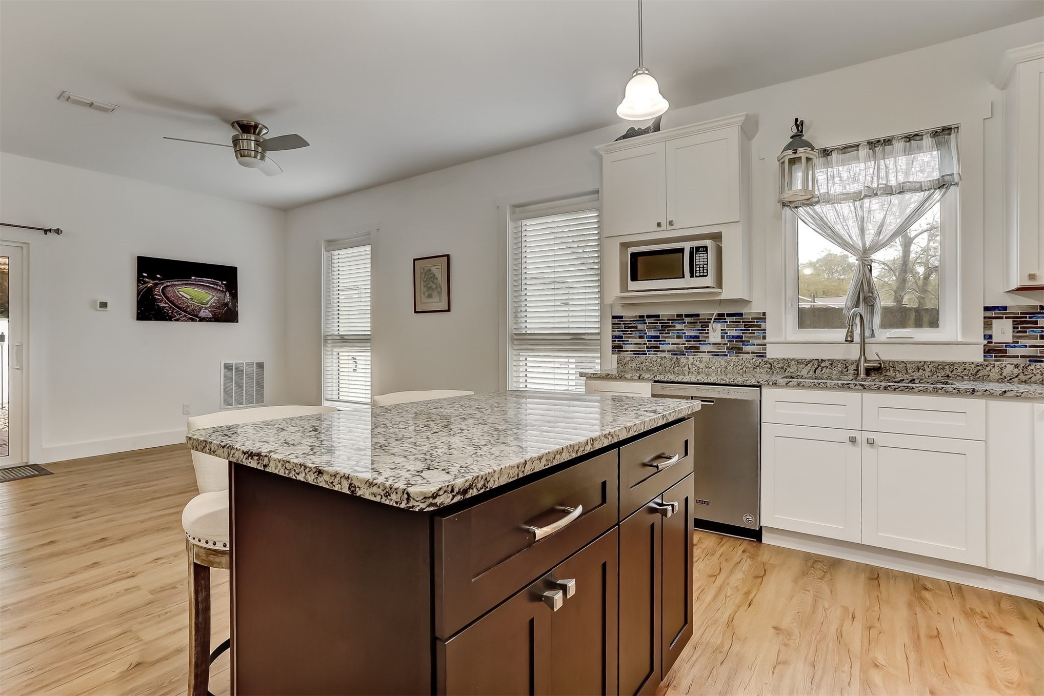 1421 Hickory Street Fernandina Beach, FL 32034 - Photo 8 of 22 a kitchen with stainless steel appliances granite countertop a sink dishwasher a stove and a refrigerator