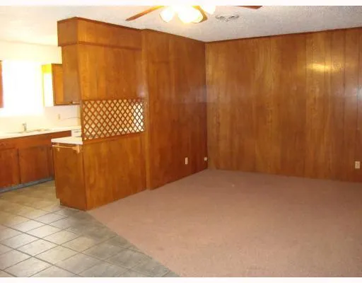 a view of a room with wooden walls