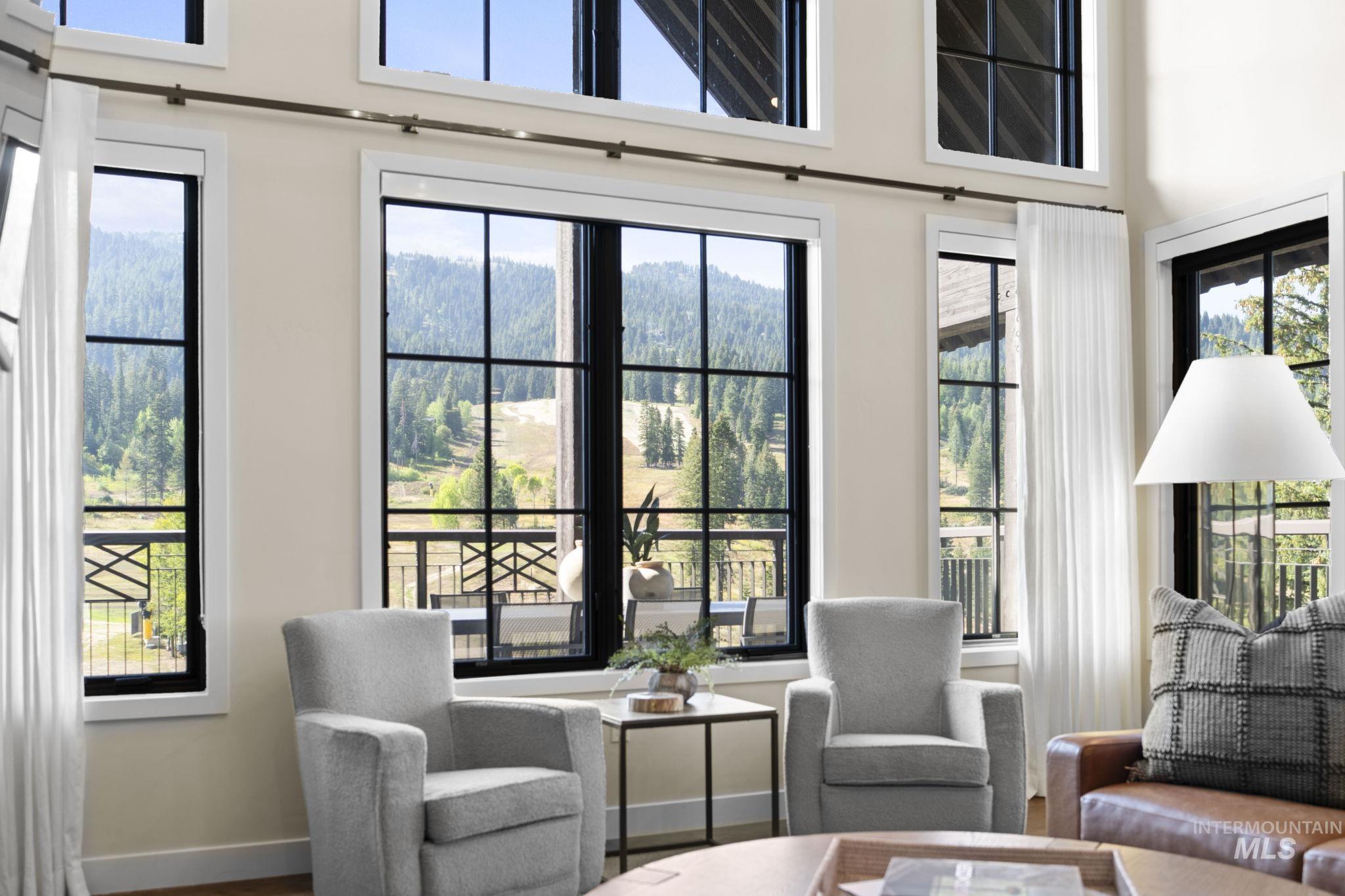 700 Village Drive, Unit 403 Donnelly, ID 83615 - Photo 11 of 43 Sitting room featuring a forest view and wood finished floors