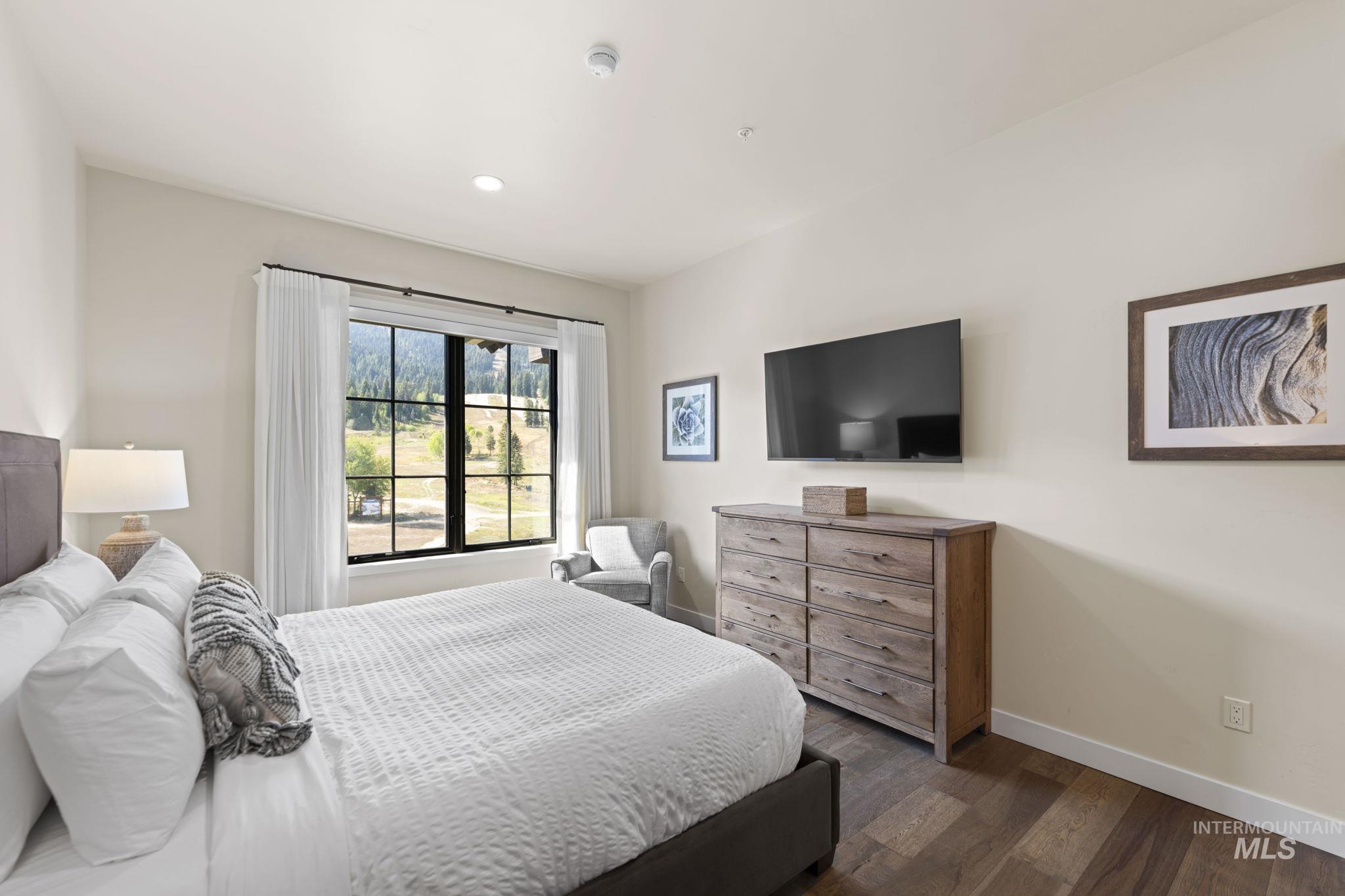 700 Village Drive, Unit 403 Donnelly, ID 83615 - Photo 36 of 43 Bedroom with dark wood finished floors and recessed lighting