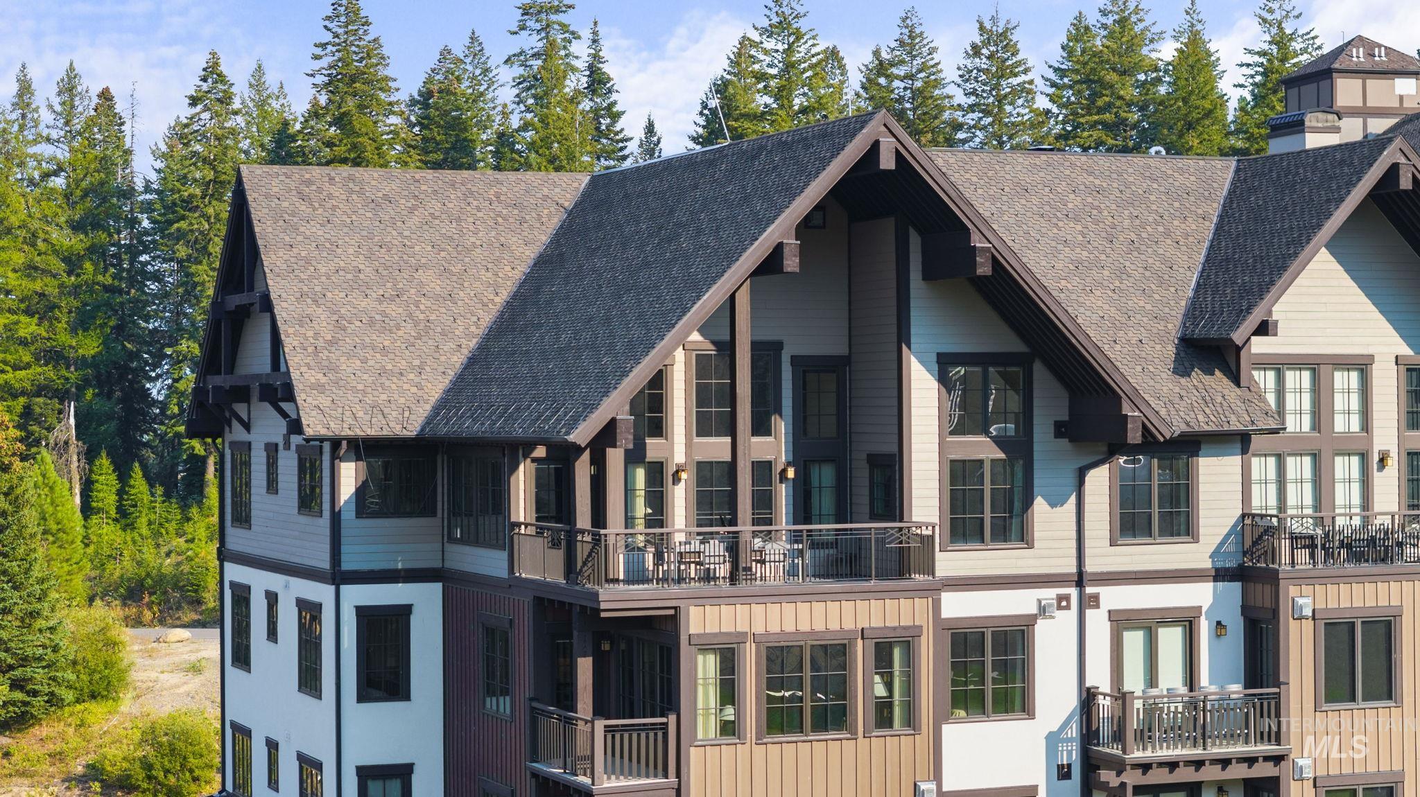 700 Village Drive, Unit 403 Donnelly, ID 83615 - Photo 6 of 43 Back of property with a balcony and board and batten siding