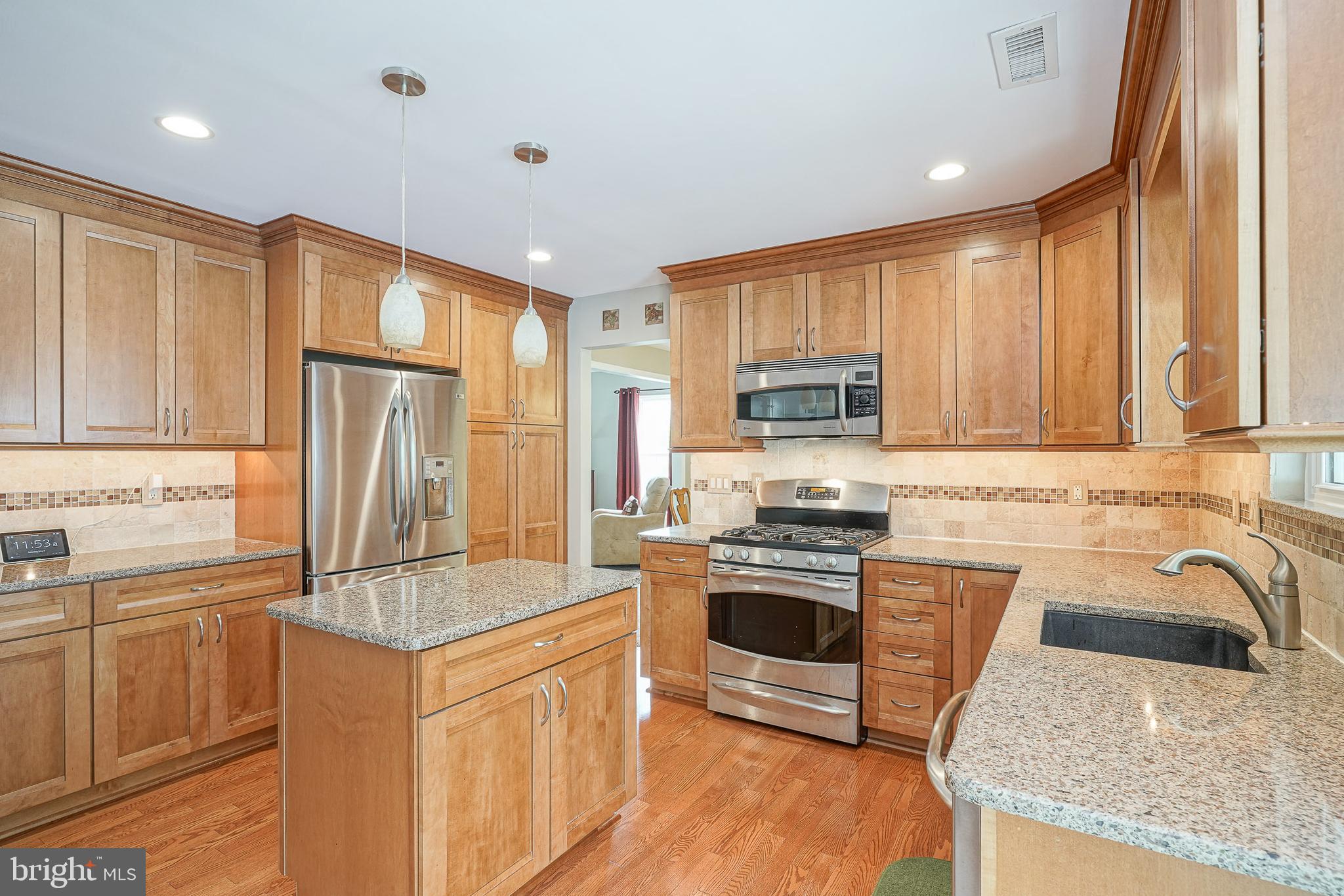 14 Filly Way Sewell, NJ 08080 - Photo 13 of 44 a kitchen with granite countertop a sink stove and refrigerator