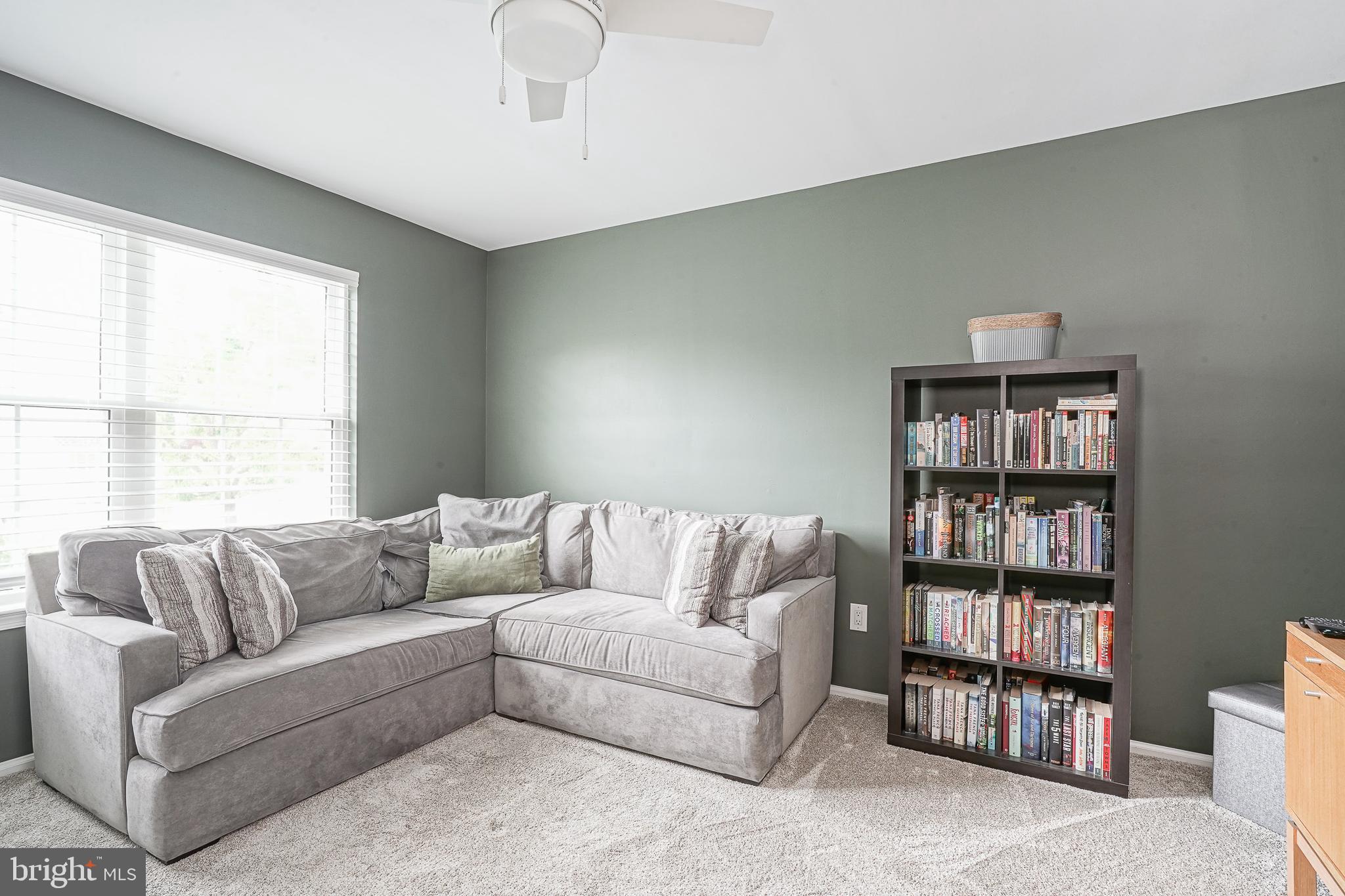 14 Filly Way Sewell, NJ 08080 - Photo 22 of 44 a living room with furniture and a book shelf
