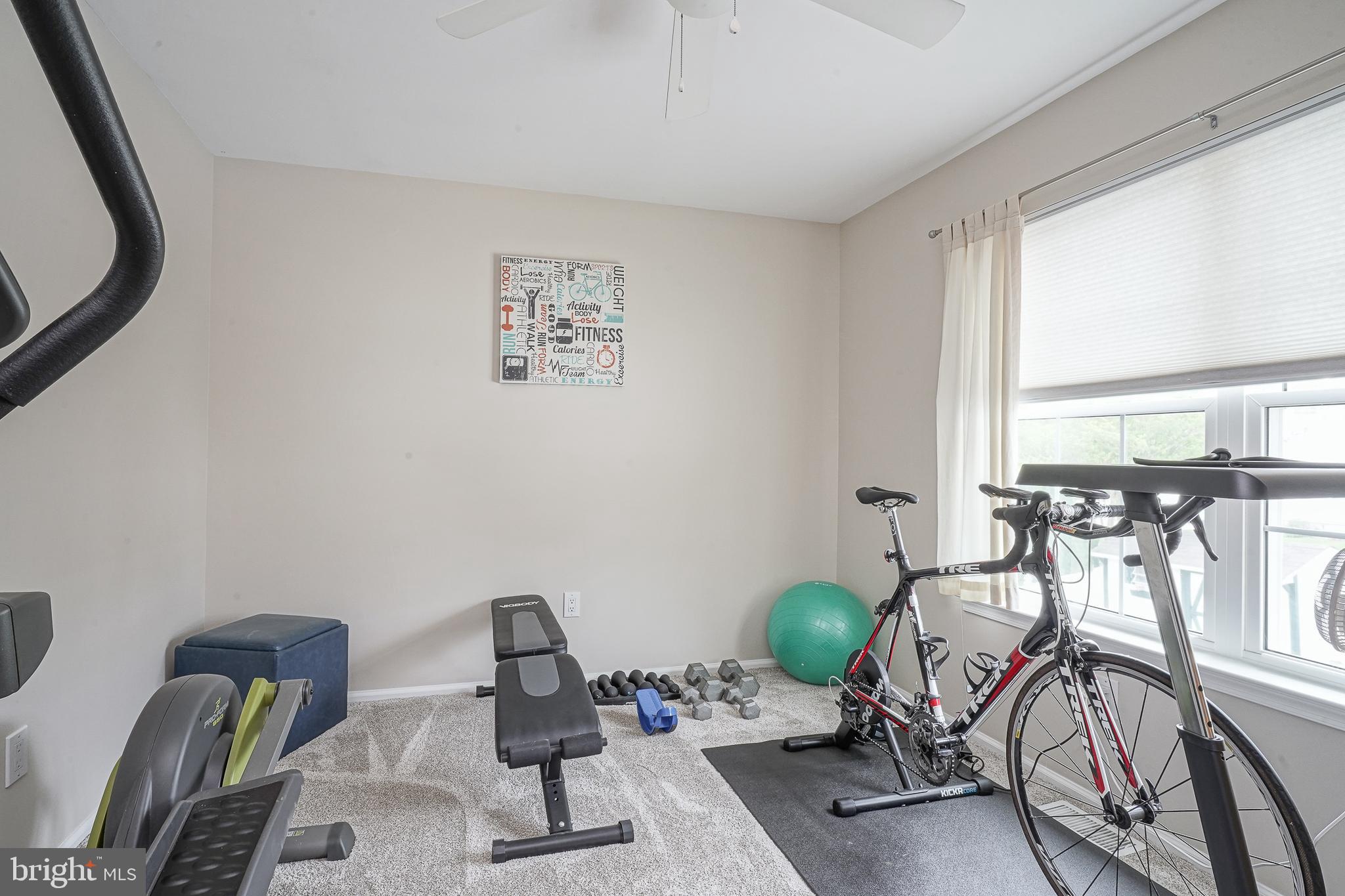 14 Filly Way Sewell, NJ 08080 - Photo 29 of 44 a view of a livingroom with furniture and gym equipment