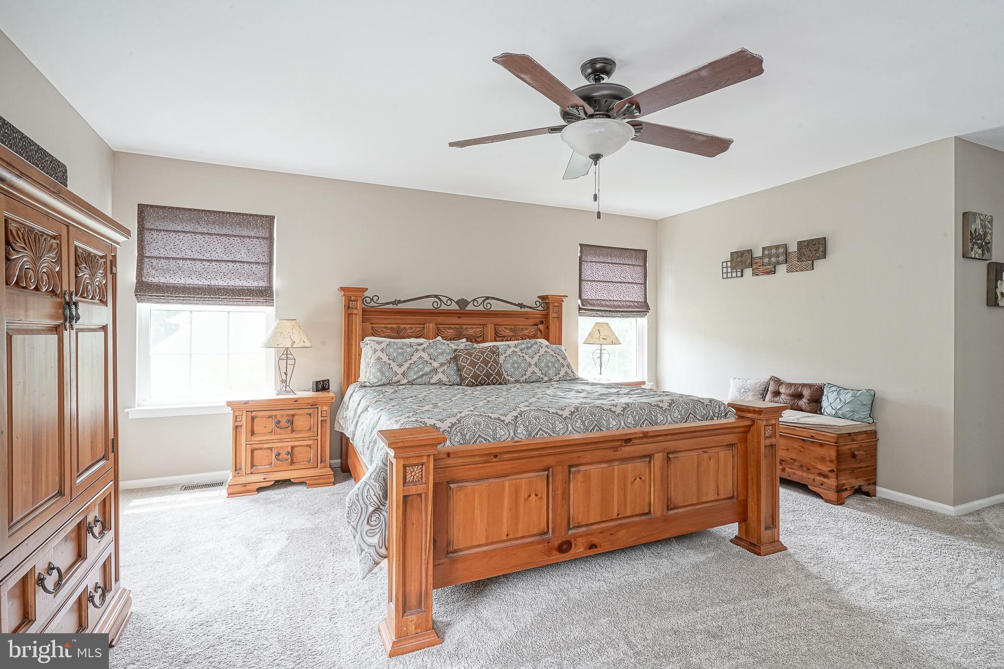 14 Filly Way Sewell, NJ 08080 - Photo 32 of 44 a bedroom with a bed and a ceiling fan