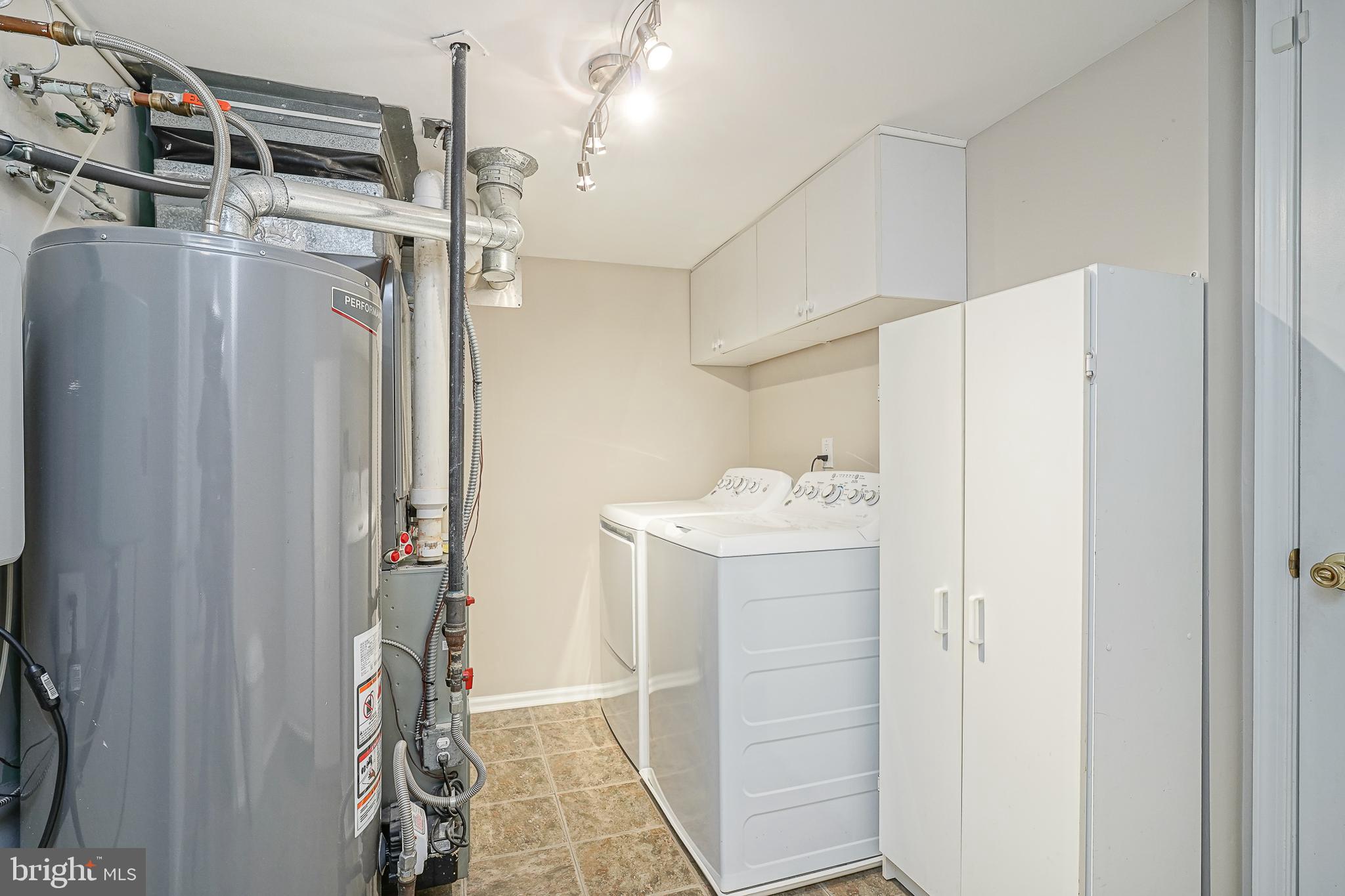 14 Filly Way Sewell, NJ 08080 - Photo 38 of 44 a utility room with cabinets washer and dryer