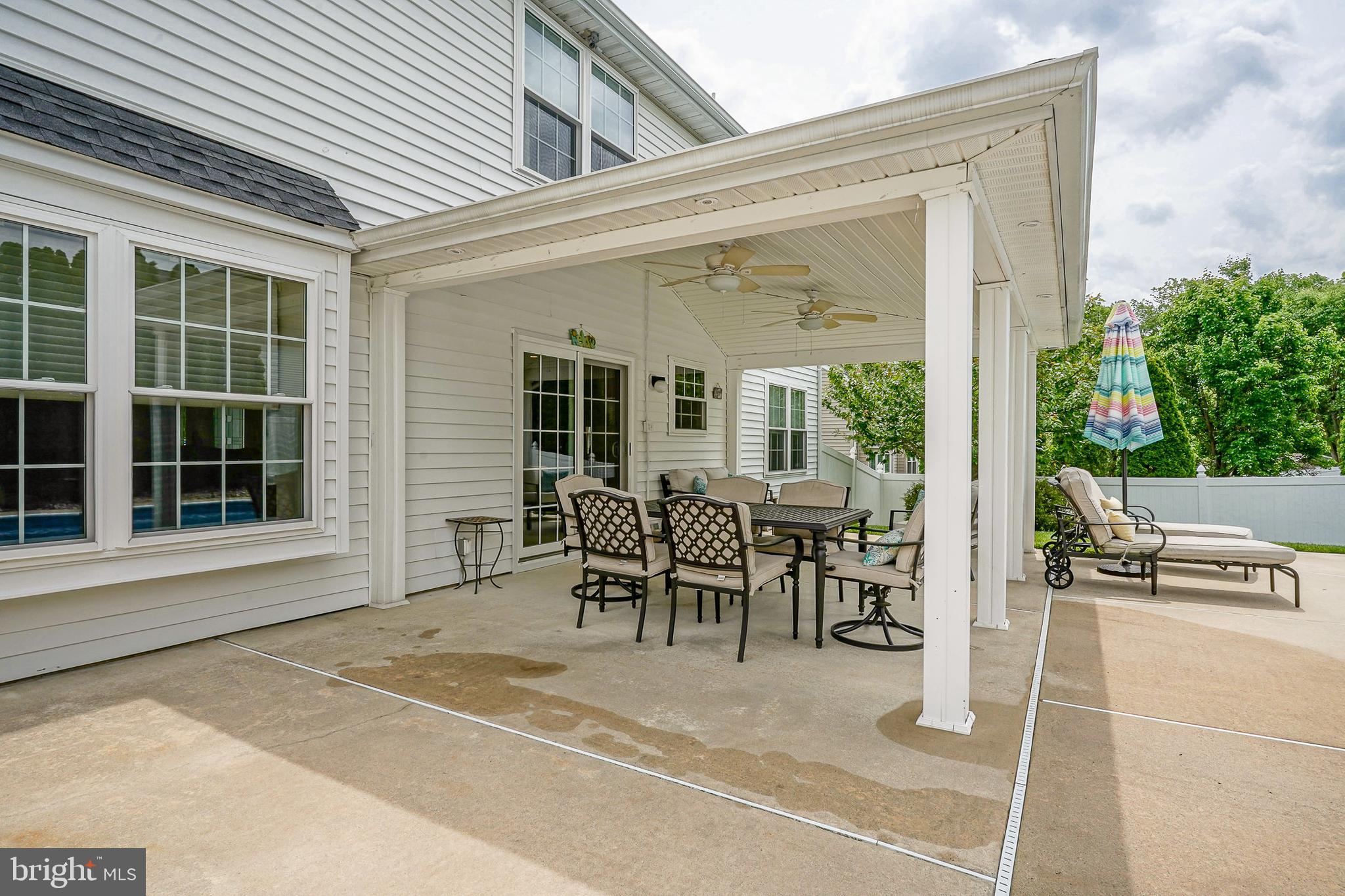 14 Filly Way Sewell, NJ 08080 - Photo 39 of 44 a view of a patio with table and chairs and potted plants